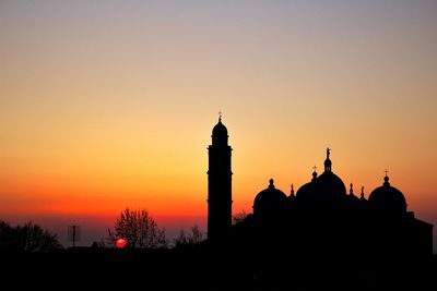 Silhouette of church at sunset