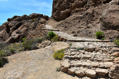 Rock formation on land against sky