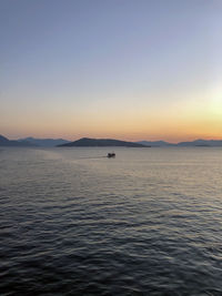 Scenic view of sea against clear sky during sunset