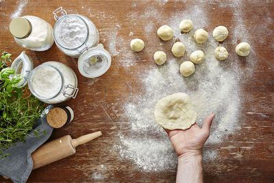 High angle view of person preparing food on table