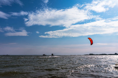 A windsurfer at sea. the sea is stormy. waves and outdoor activities.