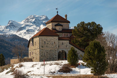 Silvaplana,switzerland, february 21, 2023 historic old castle crap da sass at the lake of silvaplana 