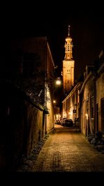 Illuminated street lights in city at night