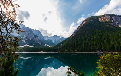 Scenic view of lake and mountains against sky