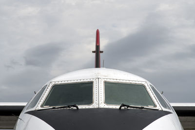 Cropped image of airplane against sky