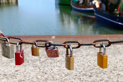 Close-up of love locks on chain