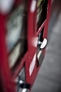 Close-up of red light on metal