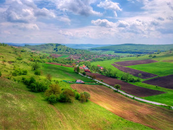 Scenic view of agricultural field against sky