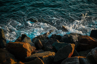 High angle view of rocks at beach