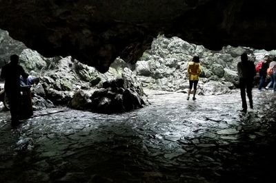 Woman standing on rock formation