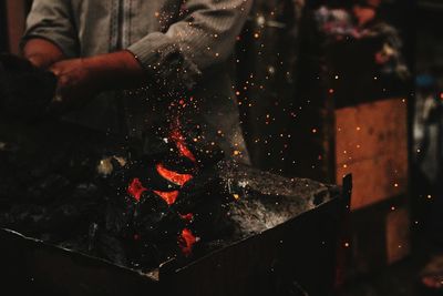 Close-up of man working at night