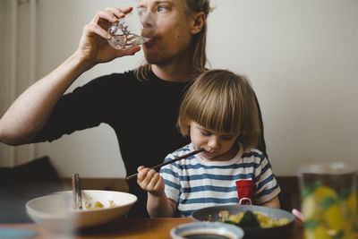 Father and daughter having meal