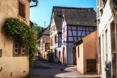 Small alleyway with alsatian half timbered houses built along. taken in colmar, france