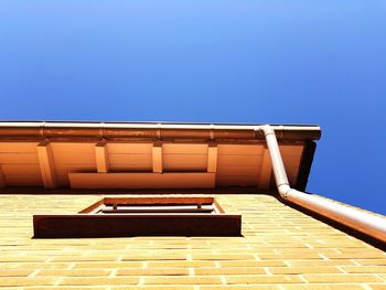 Low angle view of building against clear blue sky