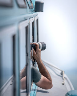 Close-up of man holding camera