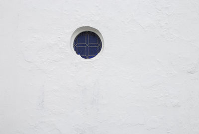 Close-up of window on white wall