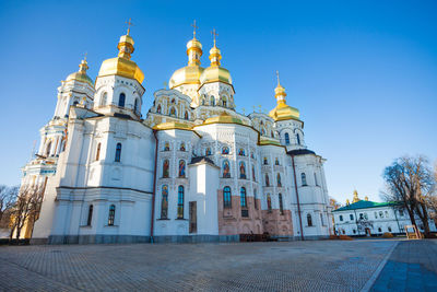 Low angle view of building against blue sky