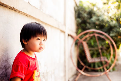 Portrait of cute girl standing outdoors