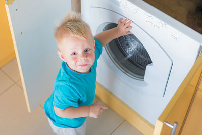 Portrait of cute girl sitting on table