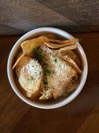 High angle view of potato chips in bowl on table