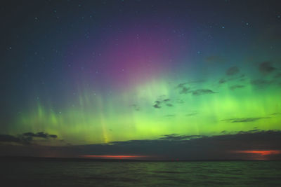 Scenic view of sea against sky at night