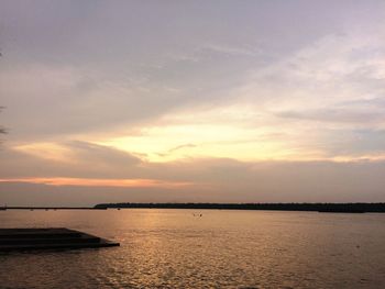 Scenic view of sea against sky at sunset