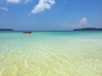 Scenic view of sea against blue sky