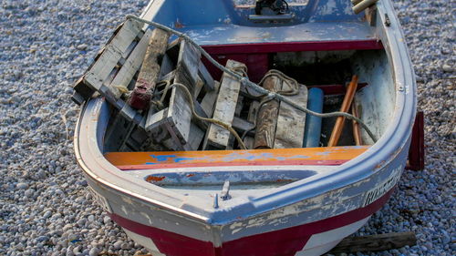 High angle view of abandoned boats on field