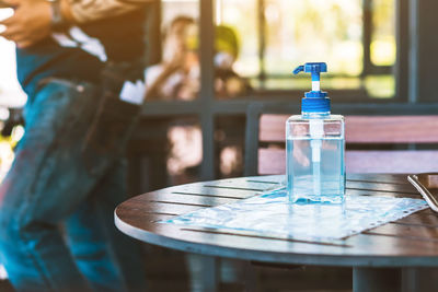 Close-up of glass bottle on table