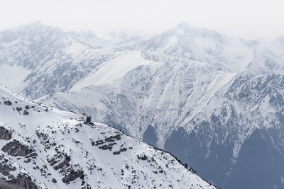 Scenic view of snow covered mountains