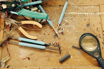 High angle view of various work tools in garage