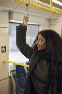 Woman in train looking away