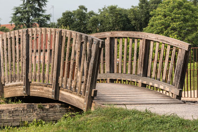 Wooden bridge in field