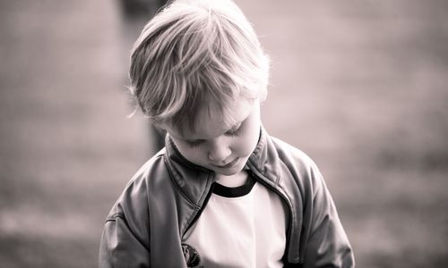 Close-up of boy standing outdoors