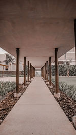 Empty walkway with bridge in background