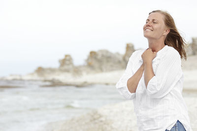 Smiling woman on beach