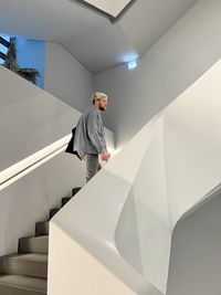 Low angle view of man standing in building