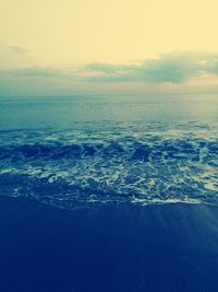 Scenic view of sea against sky at sunset