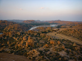 Scenic view of landscape against sky during sunset