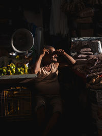 Midsection of woman holding ice cream in basket