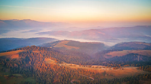 Scenic view of landscape against sky during sunset