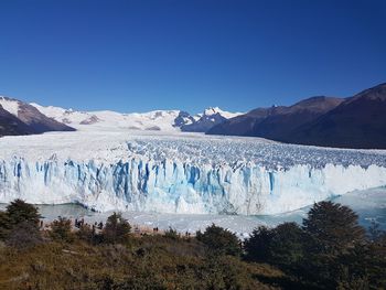 Scenic view of landscape against clear blue sky