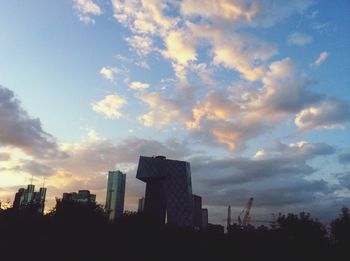 Buildings in city at sunset