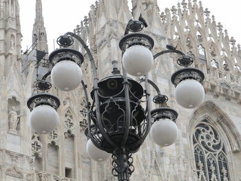 Low angle view of lamp post against sky