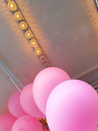 Low angle view of pink balloons
