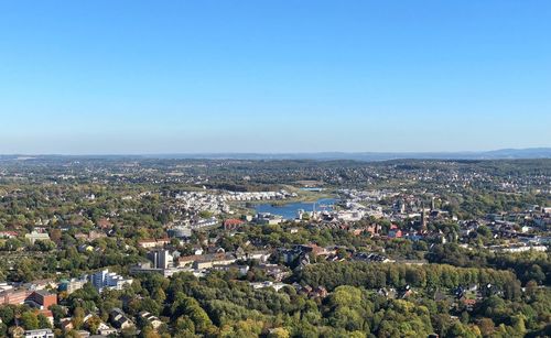 High angle view of townscape against clear blue sky