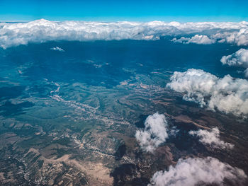 High angle view of sea and land against sky