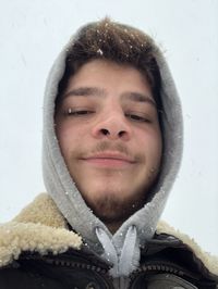 Portrait of smiling man in snow