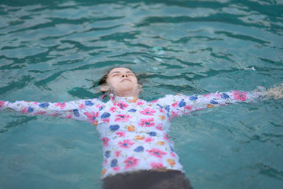 Girl swimming in pool