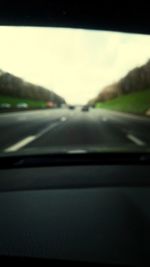 Road passing through car windshield